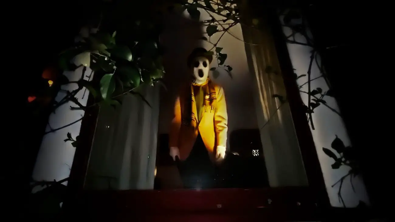 A creepy figure looking through a window