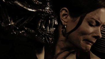 A Xenomorph puts its mouth in the personal space of a resistant woman in Aliens Vs. Predator Requiem