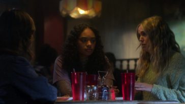 The girls sit at their table in the pizza place, after being cleared of wrongdoing for Karen's death