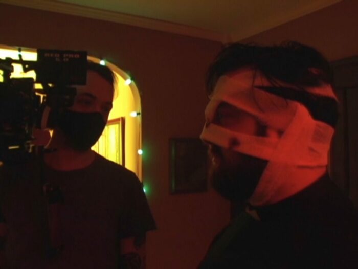 Eric Pennycoff directing Graham Skipper as Father David on the set of The Leech