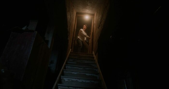 Will (played by Jon Michael Simpson) descending to the basement in Sorry About the Demon