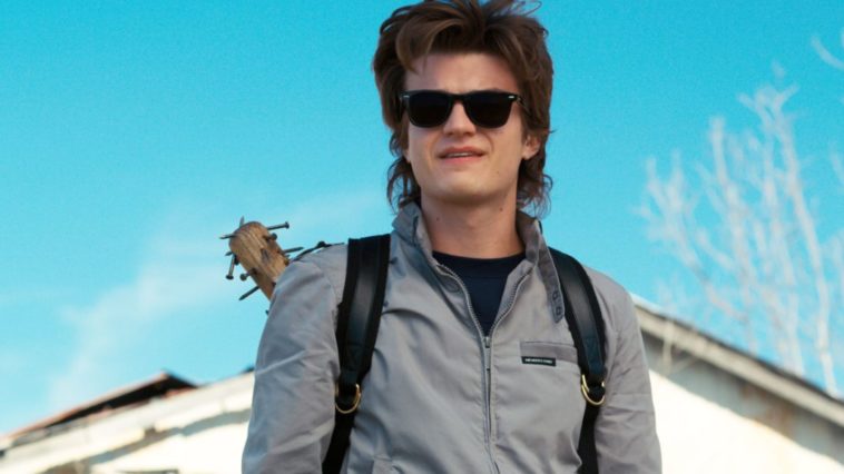 Steve wearing sunglasses, the spiky baseball bat on his back, looking awesome