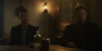 Thomas and Josiah sit at the dining room table looking toward the camera in What Josiah Saw