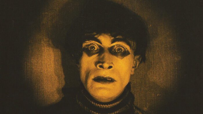 The Somnambulist stares out at you as he wakes for the first time in The Cabinet of Dr Caligari
