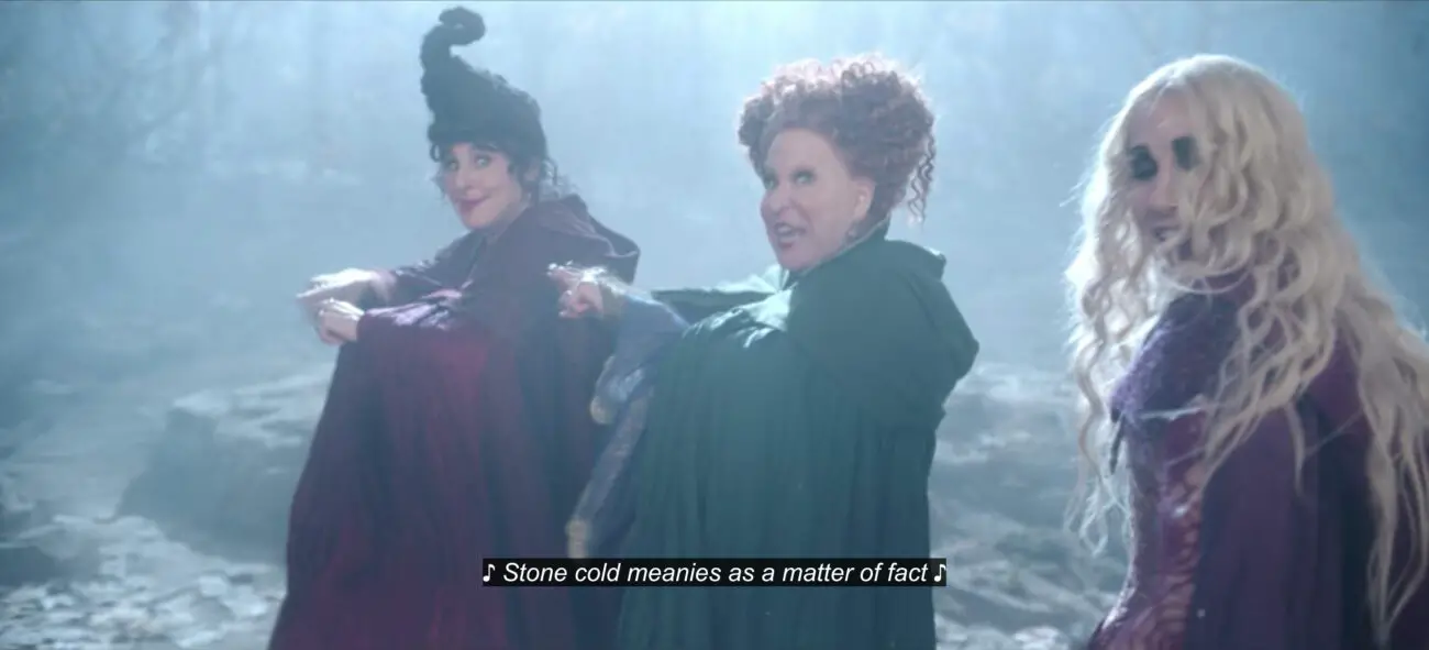 Winifred Sanderson (Bette Midler) sings, "Stone cold meanies as a matter of fact," while dancing with Mary Sanderson (Kathy Najimy) and Sarah Sanderson (Sarah Jessica Parker), in the film, "Hocus Pocus 2" (2022).