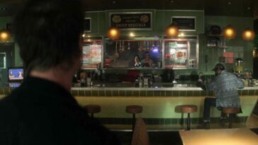 An over the shoulder shot of John Dee looking at the diner
