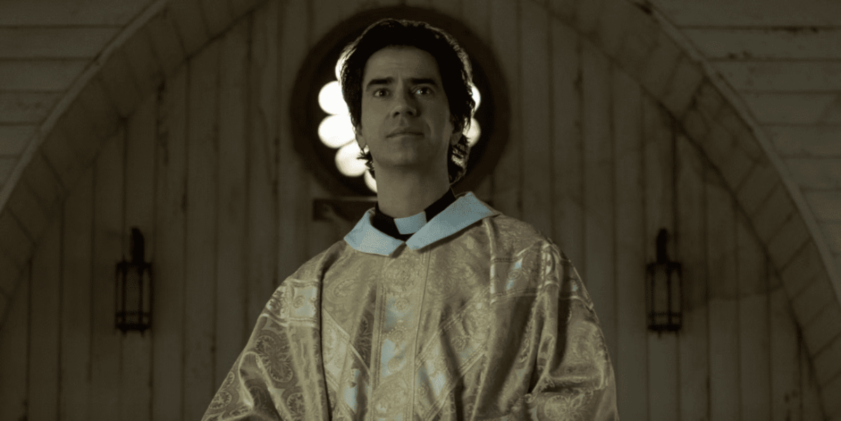 Father Paul in his gold robes stood in the church