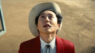 Steven Yeun as Ricky "Jupe" Park looking skyward
