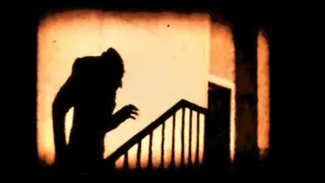 Nosferatu's shadow creeps up the stairs