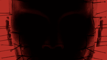 A silhouette of Pinhead against a deep red background