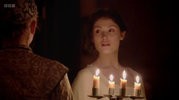 Gemma Arterton as The Duchess, illuminated by candles