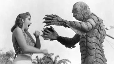 The Gill-man attacking a woman