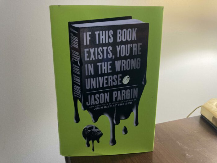 Cover for If This Book Exists You're in the Wrong Universe shows a book made of Soy Sauce and a black skull at the bottom