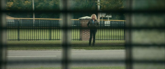 Laurie is seen through the blinds in Halloween (2018)