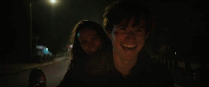 Allyson and Corey smile while riding on Corey's motorcycle in Halloween Ends