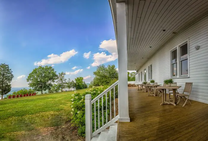 A porch sits in the bright sunlight