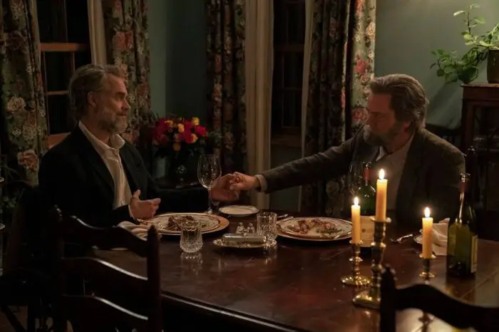 Frank and Bill hold hands at the dining table in The Last of Us episode 3 "Long Long Time"