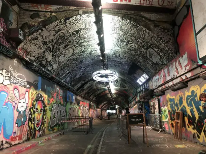 The Tunnel, located in Waterloo, spans nearly 2/10 of a mile, walls covered with graffiti.