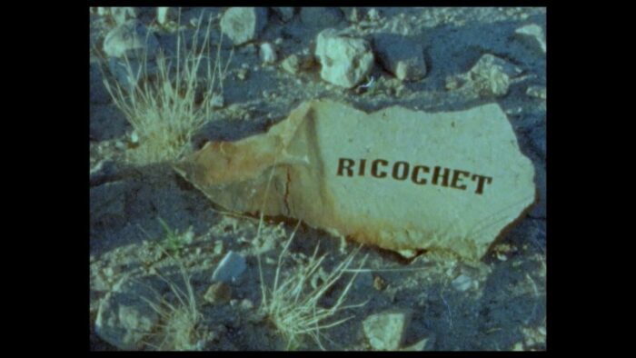 Title card for Ricochet, a piece of paper has the word "Ricochet" on it