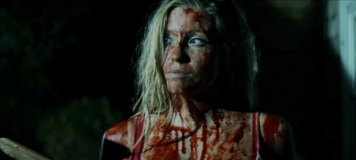 Audra stands in the moonlight covered in blood in Kill Her Goats