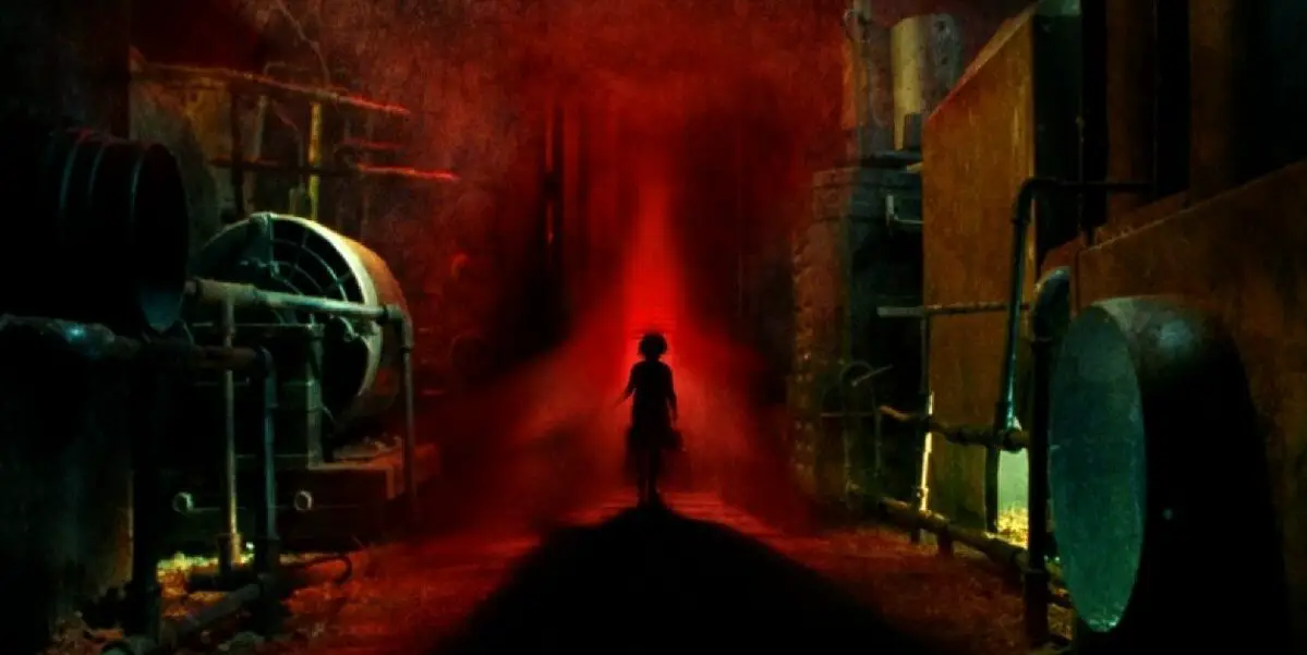 A silouette of a young girl is seen in the glow of a red light walking through a pipe-filled industrial area in Moon Garden