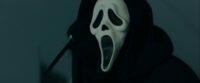 Ghostface holds a knife threateningly