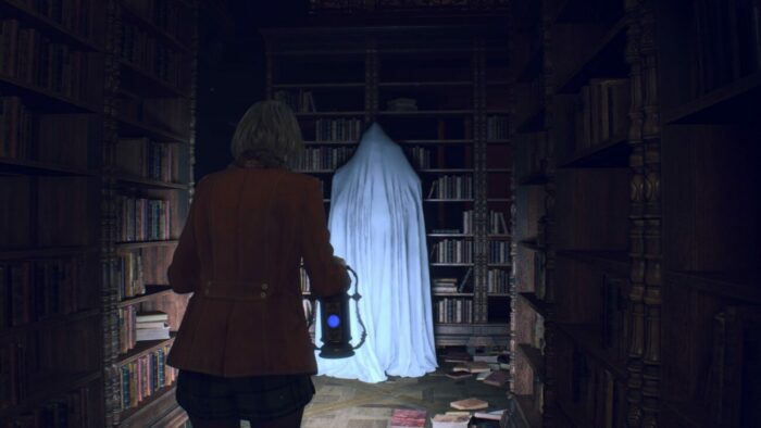 Ashley is holding a lamp and creeping around in a library.