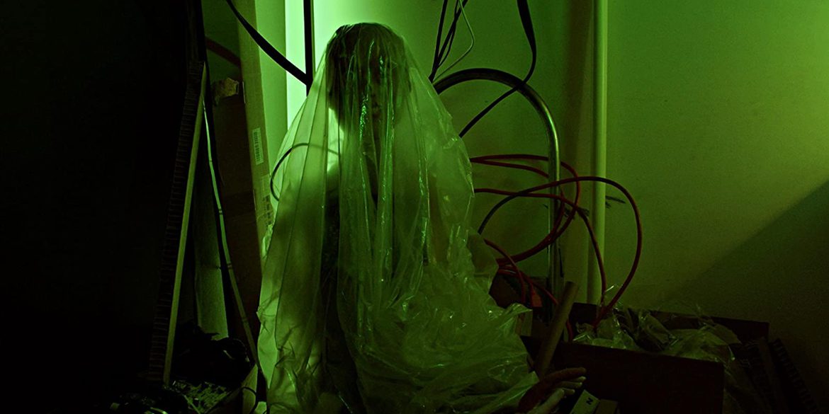 A human sized doll covered in plastic