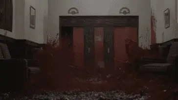A wave of blood splashes through the hallway of the Overlook Hotel