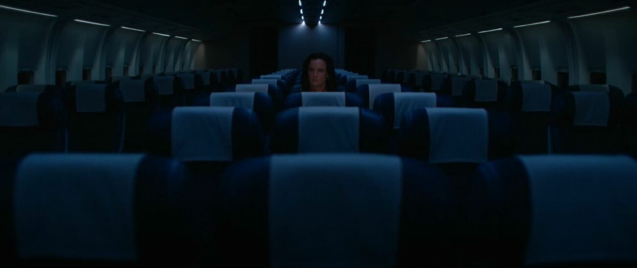 Natalie alone on the plane