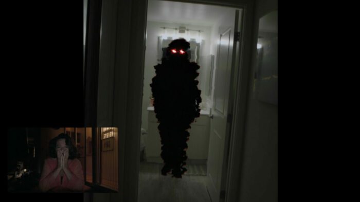 A floating figure with red eyes in a doorway