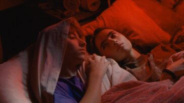 two kids talking in bed