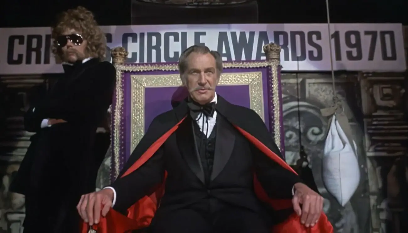 Vincent Price sitting down