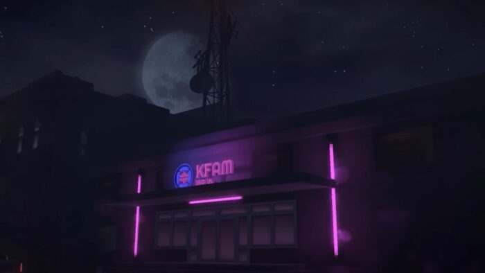 A nighttime shot of the front of the radio station KFAM, the sign is highlighted by purple neon
