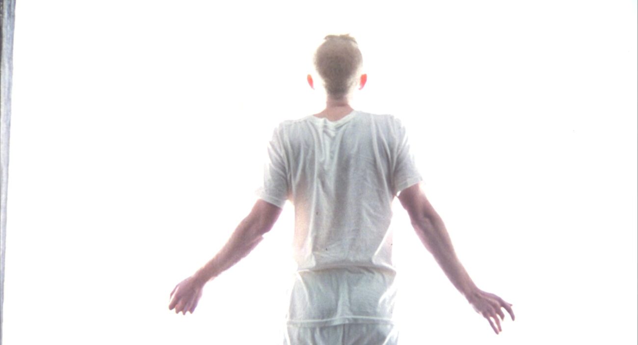 Kazan exits the cube and enters into a bright light at the end of Cube