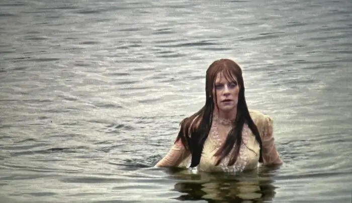 The undead Abigail Bishop rises from the lake