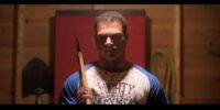 Tom hoists an ax over his shoulder in Here for Blood