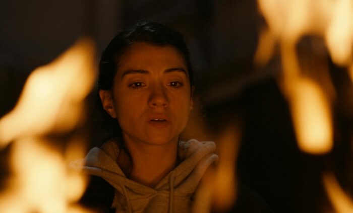 A woman by some flames