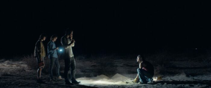 People in the desert at night