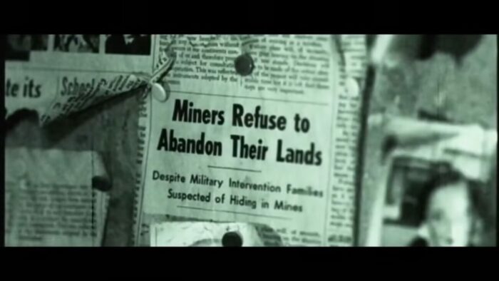 New clipping that reads, "Miners refuse to abandon their land"