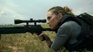 A woman with a sniper rifle