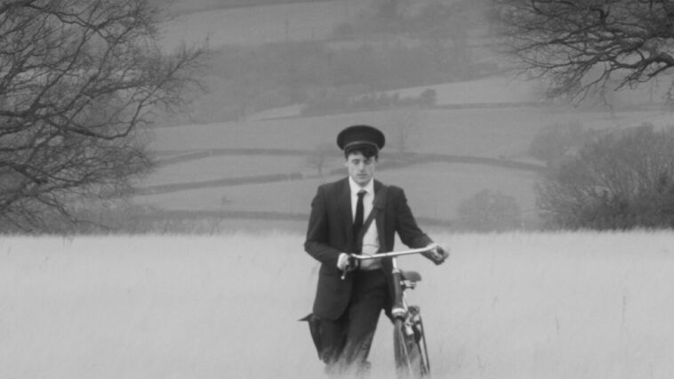 A man pushing a bike
