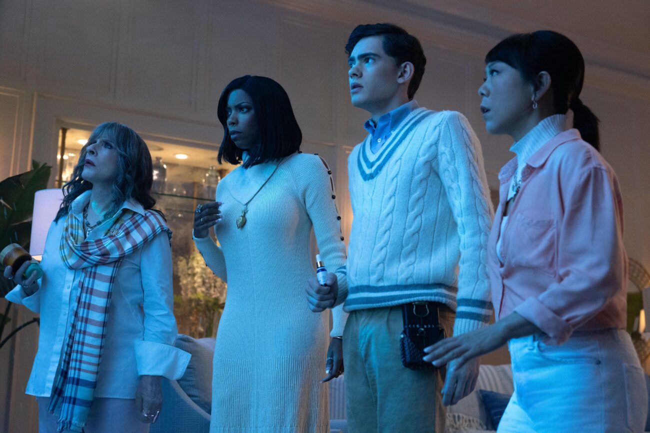 The coven watch as the water begins entering the house.