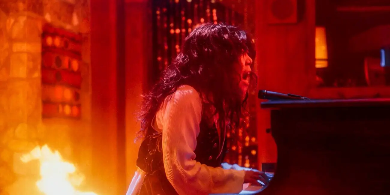 Alice singing the ballad while the studio burns around the coven.
