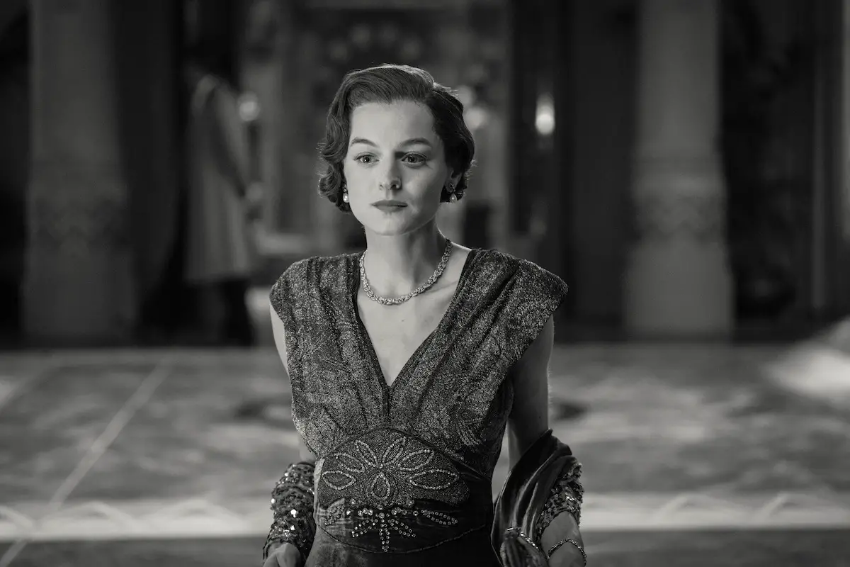 Clara walking across the hall.