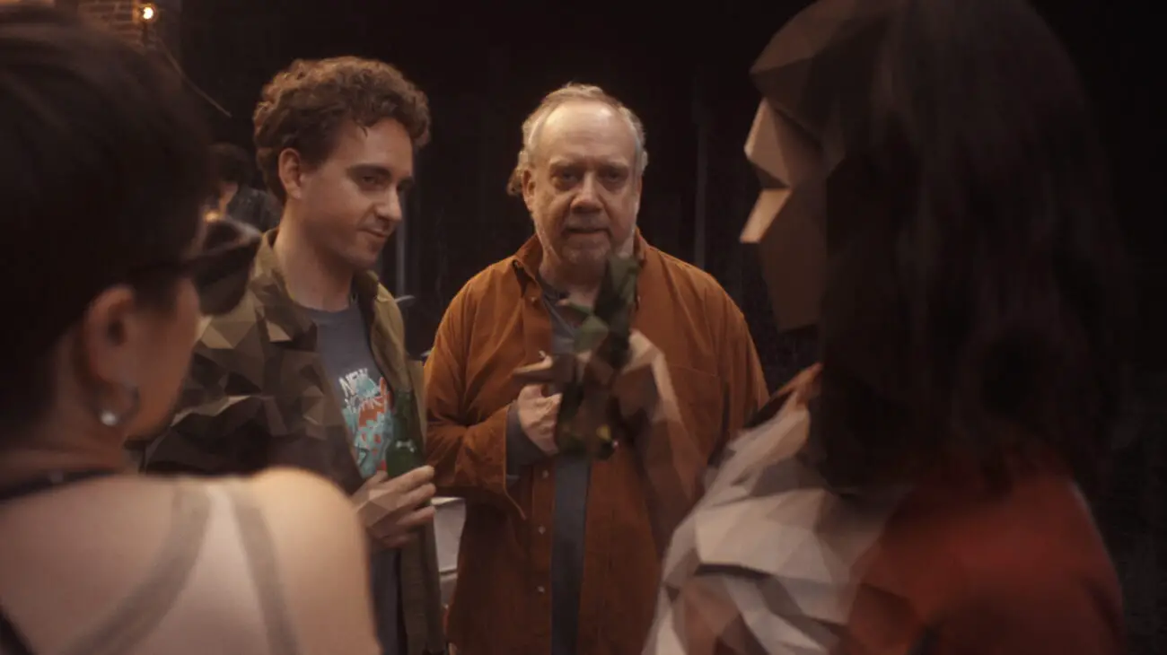 Phillip looking at his past self and Carol in a memory.